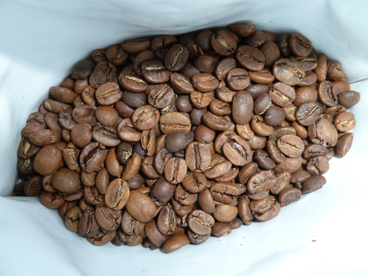 Photo of the beans in a bag of Throwdown coffee by Small Batch Coffee Roasters